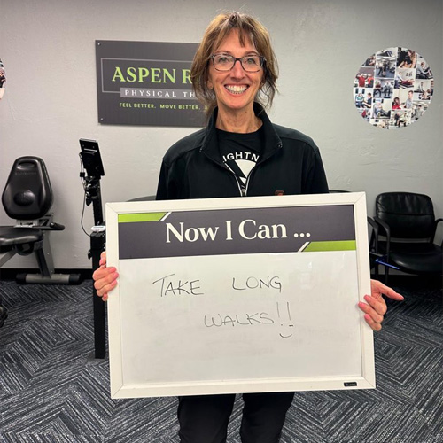 a satisfied patient from Aspen Ridge Physical Therapy after a successful physical therapy program, ready to take more long walks